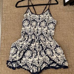 Blue and cream romper with cris cross string back